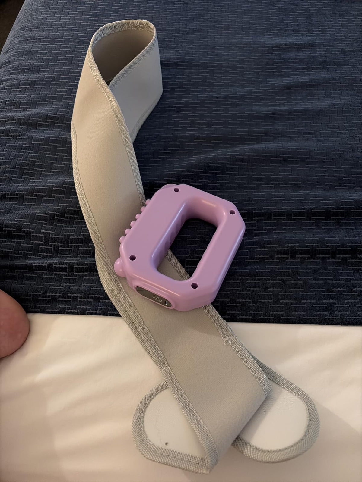 Customer wearing the Vellora Fascia Ring around her waist with the grey adjustable strap
